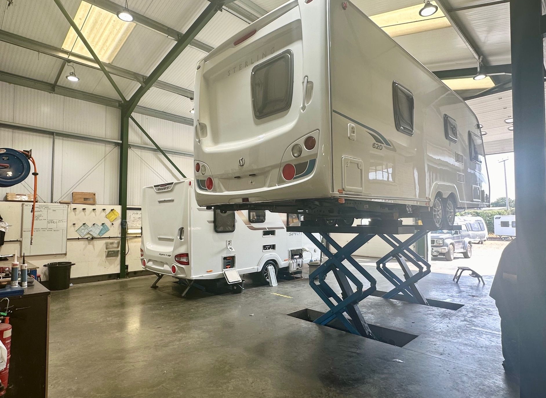 Service centre technicians working on a caravan